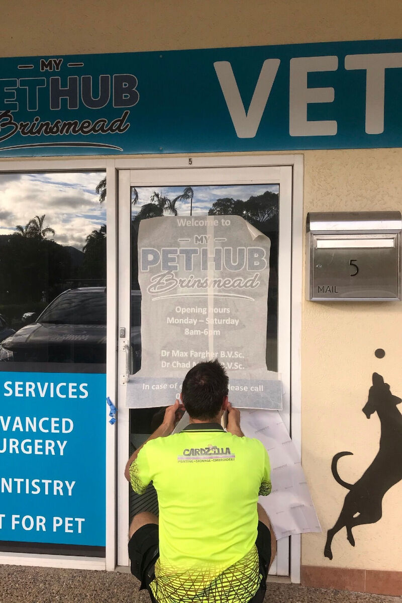 Cardzilla Stafff Member installing window decals